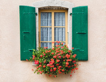 Vintage Window With Flowers And Shutters In  Switzerland
