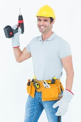 Poster - Carpenter holding cordless drill over white background