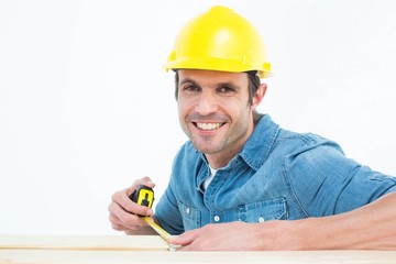 Poster - Male carpenter using measue tape