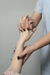 © bhakpong - Massage series : Therapist massaging woman's hand