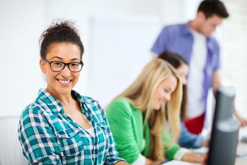 Poster - student with computer studying at school