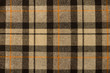 Scottish tartan pattern. Brown, orange plaid print as background