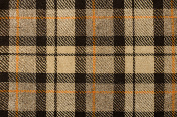 Scottish tartan pattern. Brown, orange plaid print as background