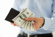 © Syda Productions - close up of businessman hands holding money