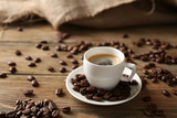 Fototapeta Kuchnia - Cup of coffee on wooden table