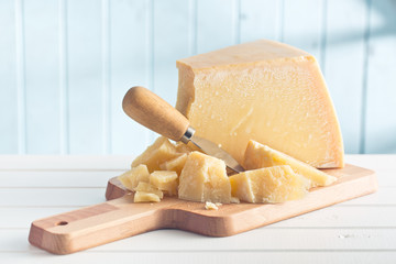 Poster - parmesan cheese on cutting board