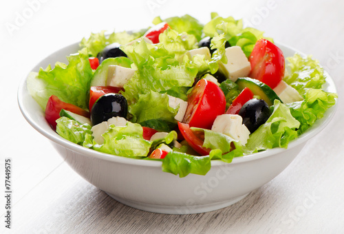 Fotografie, Obraz Fresh vegetables salad with feta, olives .