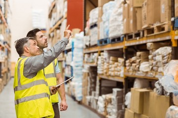 Warehouse manager talking with worker