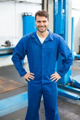 Poster - Smiling mechanic looking at camera