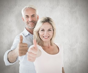 Aufkleber - Composite image of smiling couple showing thumbs up together