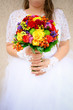 Beautiful bride holding wedding bouquet