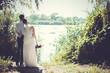 The bride and groom on the river