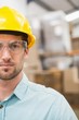 © WavebreakmediaMicro - Close up of worker wearing hard hat in warehouse