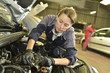 © goodluz - Technician woman working in auto repair workshop