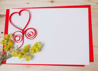 Greeting card with a red heart and space for text on a wooden ba