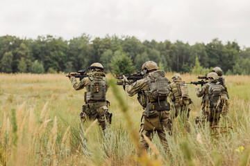 group of soldiers conducting an offensive against the enemy