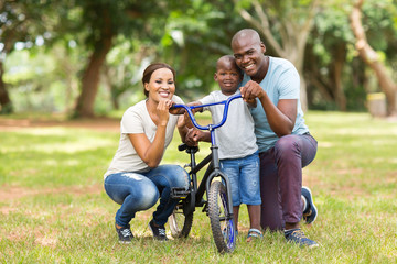 young african family of three outdoors