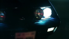 Pan Shot Of Light Up Corvettes Headlights