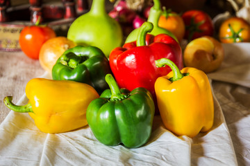 still life with peppers, herbs, vegetables and fruits as an ingr