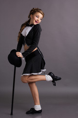 Beautiful dancer wearing gentleman costume