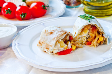 Mexican tortilla with meat stuffing, corn and vegetable salsa