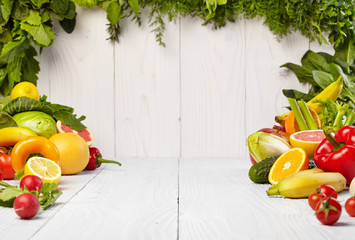 frame with fresh organic vegetables and fruits on wooden backgro