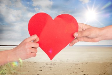 Poster - Composite image of hands holding red heart