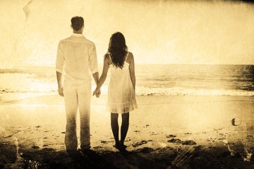 Aufkleber - Attractive couple holding hands and watching the ocean