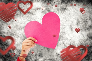 Poster - Composite image of couple holding a heart