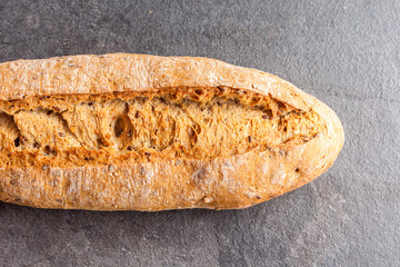 Delicious bread on grey background