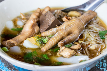 Asian delicatessen - chicken foot in noodle soup