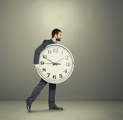 Wall Mural - man with clock going forward