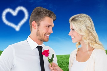 Aufkleber - Handsome man smiling at girlfriend holding a rose