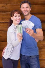 Poster - Composite image of couple holding fans of cash