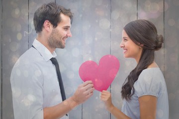 Aufkleber - Composite image of pretty brunette giving boyfriend her heart