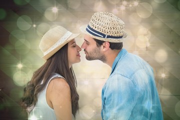 Poster - Composite image of happy hipster couple about to kiss