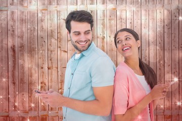 Poster - Composite image of happy couple sending text messages