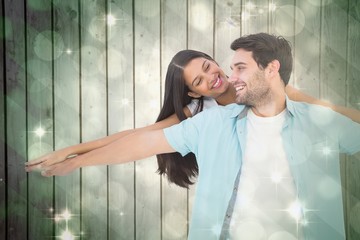 Poster - Happy casual man giving pretty girlfriend piggy back