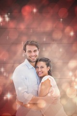 Aufkleber - Attractive young couple hugging and smiling at camera