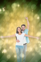 Poster - Composite image of happy casual couple cheering together