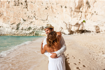 Wall Mural - bride and groom at the beach