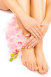 manicure and pedicure with a pink orchid flower