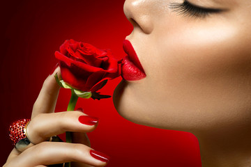 Poster - Beautiful model woman kissing red rose flower