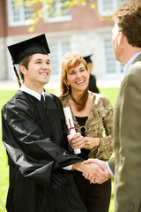 Wall Mural - Graduation: Teacher Congratulates New Graduate