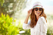 © ZoomTeam - Smiling summer woman with hat and sunglasses