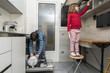 © jordi2r - Family emptying the dishwasher