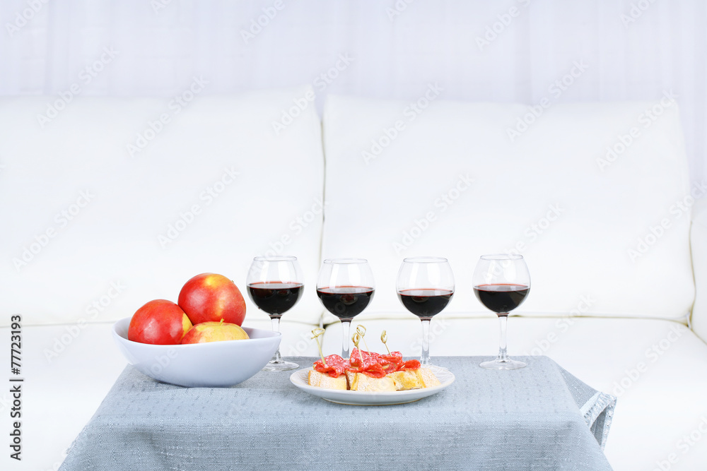 Table at home with food and drinks for friends