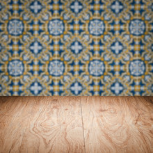 Wood Table Top And Blur Vintage Ceramic Tile Pattern Wall