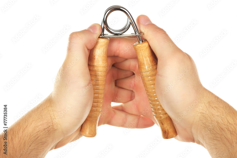 Hand trainer with steel spring in male hand, isolated on white