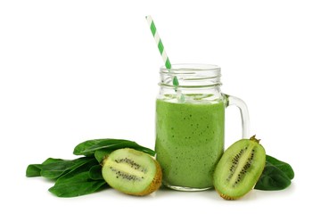 Healthy green smoothie with spinach and kiwi in a jar mug